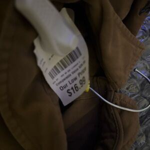 Men’s medium Levi button down brown two rips in the front of the shirt